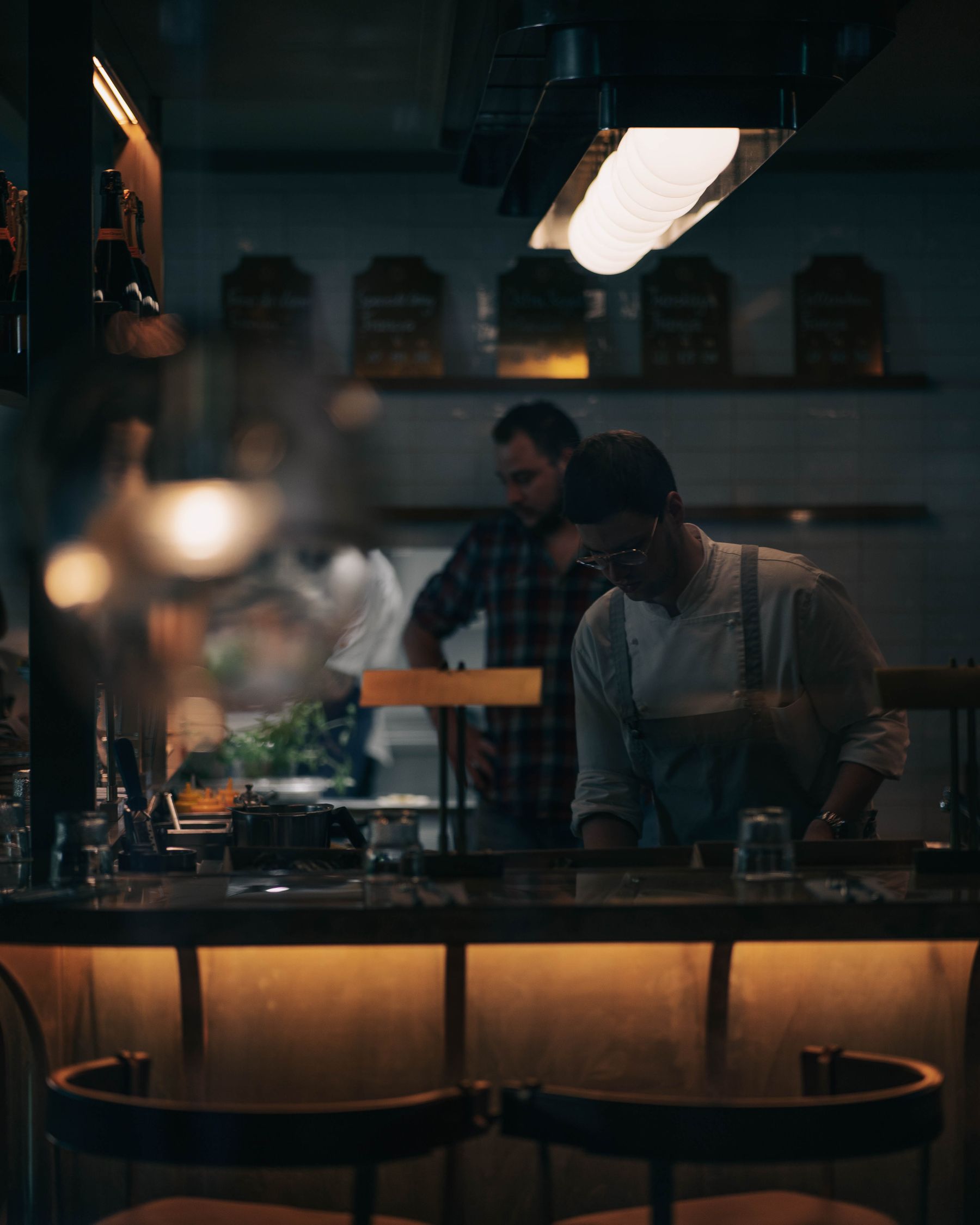 Restaurant staff prepare the dining room before service
